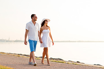 Image showing smiling couple walking outdoors