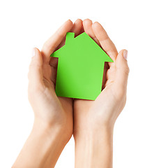 Image showing hands holding green paper house