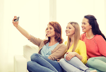 Image showing teenage girls taking selfie with smartphone