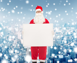 Image showing man in costume of santa claus with billboard