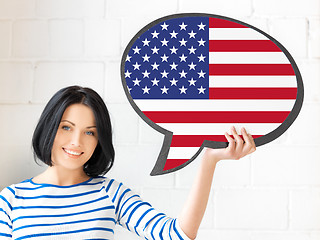 Image showing smiling woman with text bubble of american flag