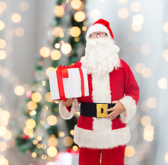 Image showing man in costume of santa claus with gift box