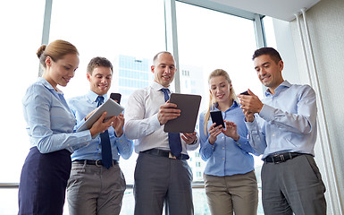 Image showing business people with tablet pc and smartphones