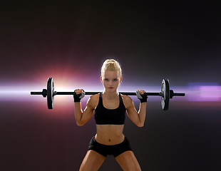 Image showing sporty woman exercising with barbell