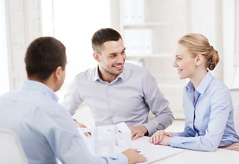 Image showing couple looking at model of their house at office