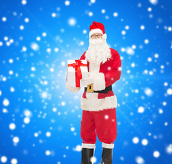 Image showing man in costume of santa claus with gift box