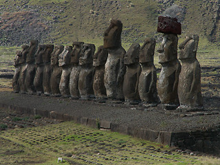 Image showing Row Of Moai Against Mountain