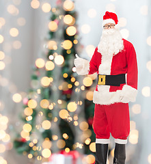 Image showing man in costume of santa claus showing thumbs up