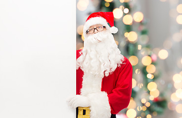 Image showing man in costume of santa claus with billboard