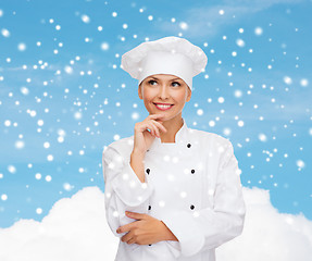 Image showing smiling female chef dreaming