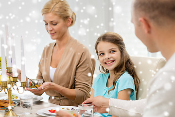 Image showing smiling family having holiday dinner at home