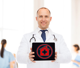 Image showing smiling male doctor with stethoscope and tablet pc