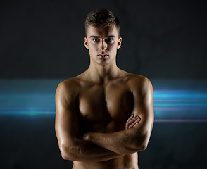 Image showing young male bodybuilder with bare muscular torso