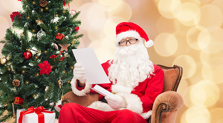 Image showing man in costume of santa claus with letter