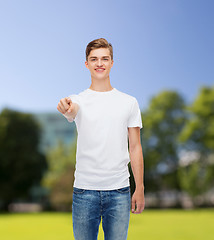 Image showing smiling young man in blank white t-shirt