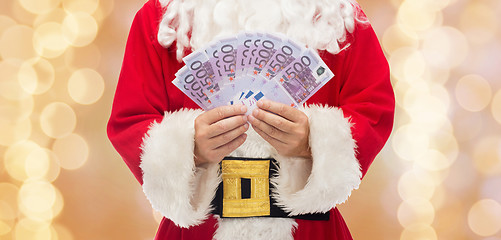 Image showing close up of santa claus with euro money