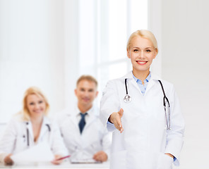 Image showing smiling female doctor with stethoscope