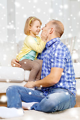 Image showing smiling father and daughter hugging at home