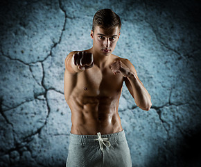 Image showing young man in fighting or boxing position