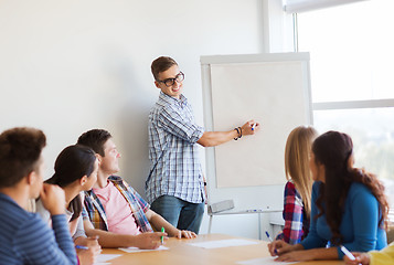 Image showing group of smiling students with white board