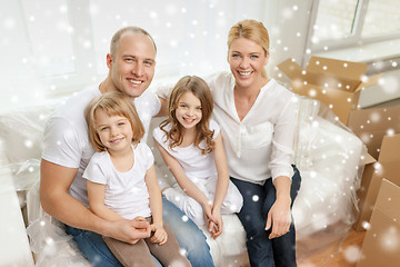 Image showing smiling parents and two little girls at new home