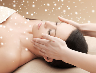 Image showing beautiful woman getting face or head massage