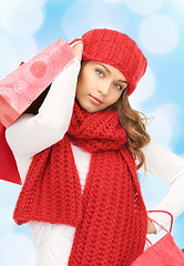 Image showing smiling young woman with shopping bags