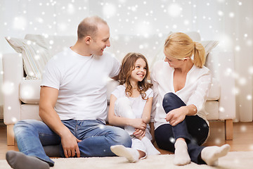 Image showing smiling parents and little girl at home