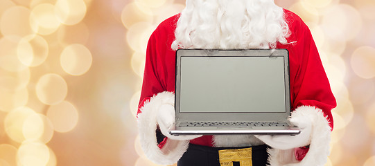 Image showing close up of santa claus with laptop