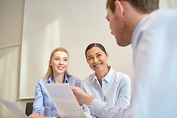 Image showing group of smiling businesspeople meeting in office