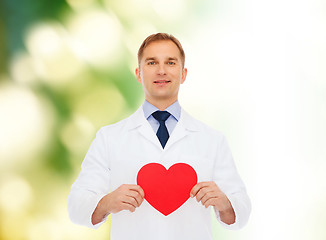 Image showing smiling male doctor with red heart