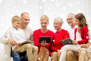 Image showing smiling family with tablet pc computers at home