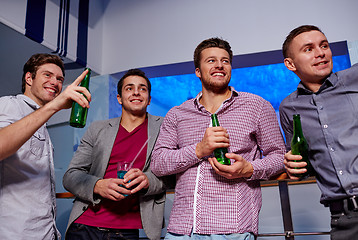 Image showing group of male friends with beer in nightclub