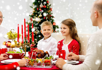 Image showing smiling family having holiday dinner at home