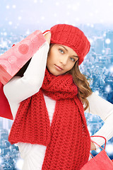 Image showing smiling young woman with shopping bags