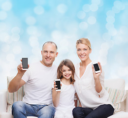 Image showing happy family with smartphones