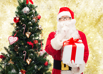 Image showing man in costume of santa claus with gift box