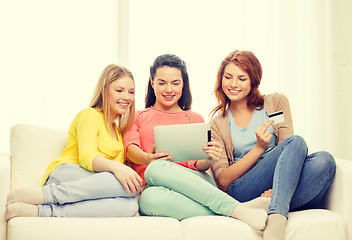 Image showing teenage girls with tablet pc and credit card