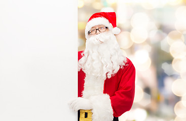 Image showing man in costume of santa claus with billboard