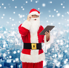 Image showing man in costume of santa claus with tablet pc