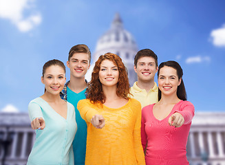 Image showing group of smiling teenagers showing ok sign