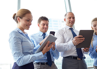 Image showing business people with tablet pc and smartphones