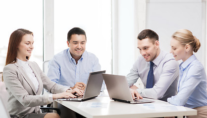 Image showing business team working with laptop in office