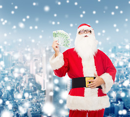 Image showing man in costume of santa claus with euro money