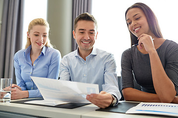 Image showing group of smiling businesspeople meeting in office