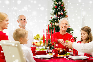 Image showing smiling family having holiday dinner at home