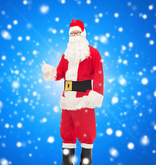 Image showing man in costume of santa claus showing thumbs up