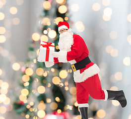 Image showing man in costume of santa claus with gift box