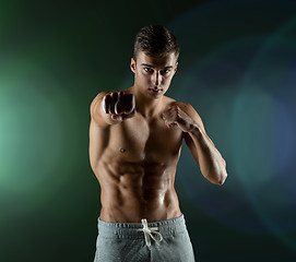 Image showing young man in fighting or boxing position