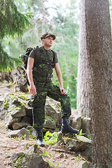 Image showing young soldier with backpack in forest